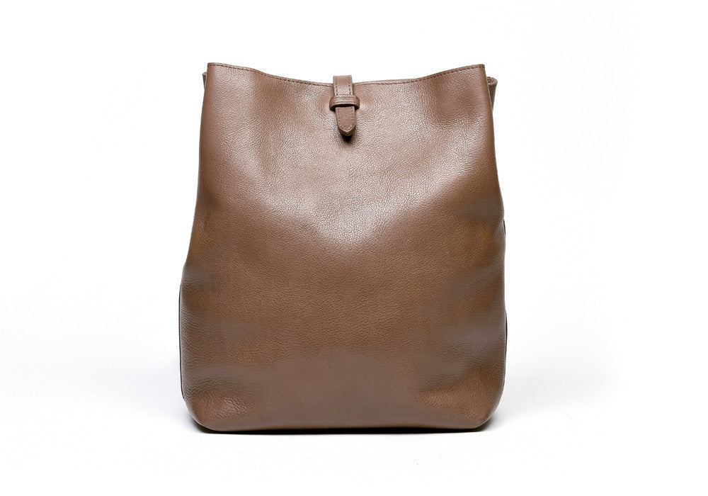 Front Leather View of The Sling Backpack Clay